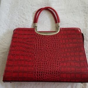 Red, alligator-embossed purse